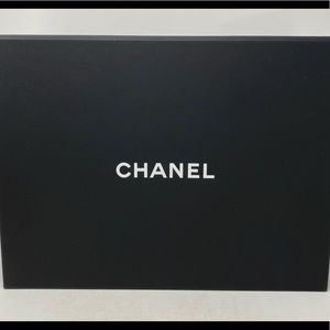 Chanel medium magnetic box with ribbon and camelia.